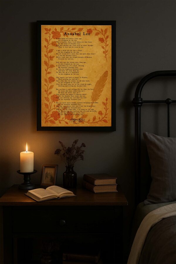 A vintage-style canvas print of Edgar Allan Poe’s “Annabel Lee” hangs above a tufted gray reading chair in a bright, cozy corner. A wooden side table with a cup and open book adds warmth to the inviting scene.