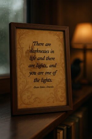 Framed Dracula quote canvas on a windowsill with warm lamplight and books, in a moody study setting.