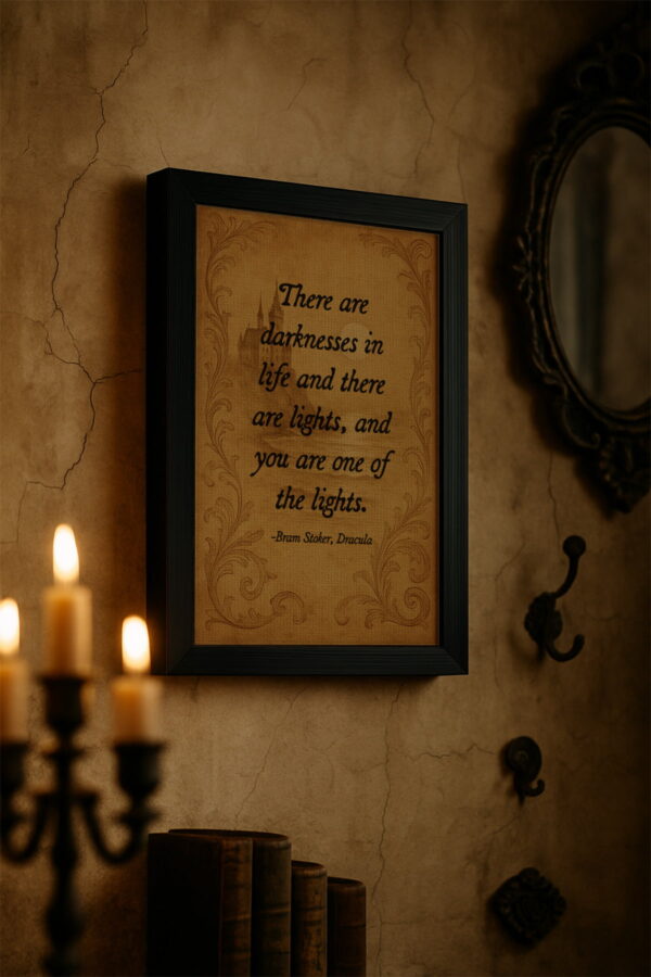Gothic-style framed quote from Dracula hanging in a dimly lit room with candlelight and textured concrete walls.