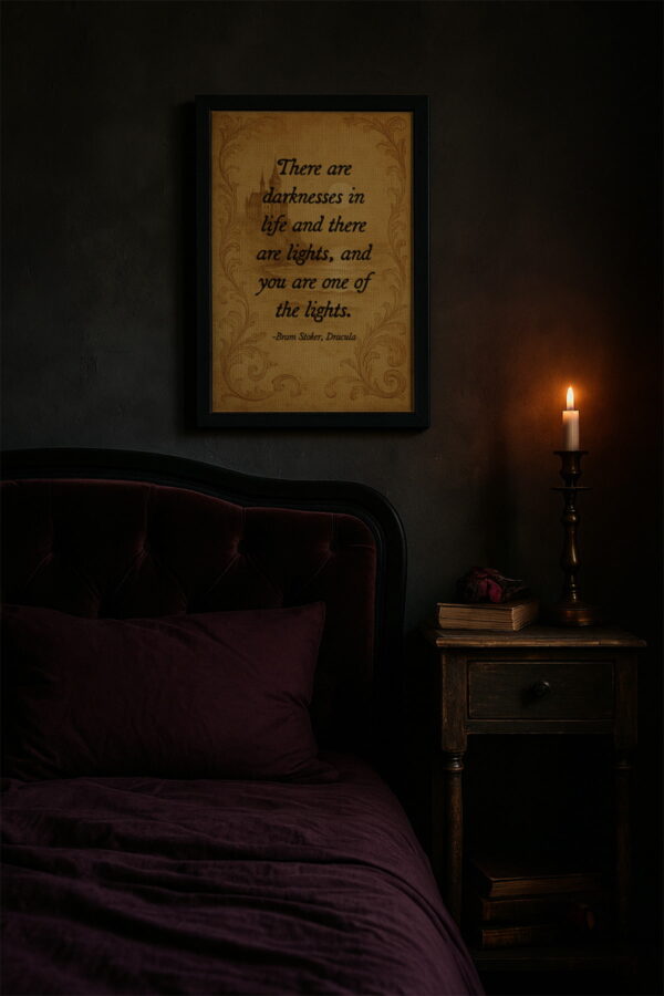 Literary Dracula quote print above a velvet bed in a dark gothic bedroom with a single candle on the nightstand.