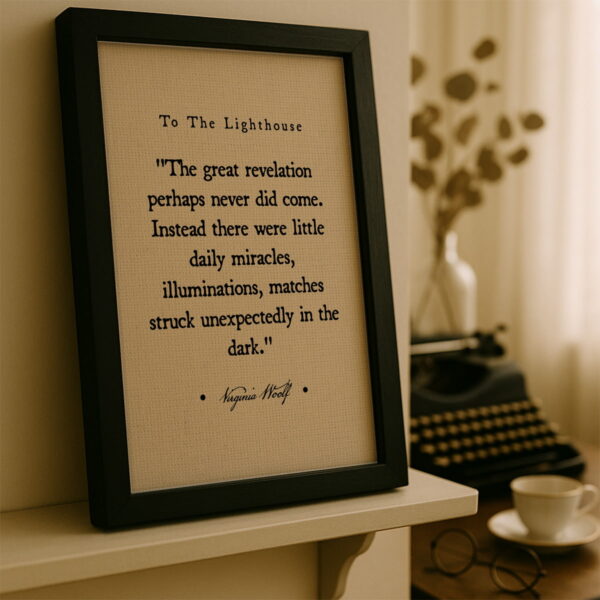 Black frame canvas leaning on a cream-colored shelf beside a typewriter and coffee cup in a softly lit writing nook.