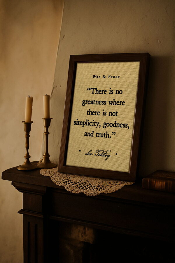 Rustic-style framed quote from War and Peace by Leo Tolstoy displayed on a mantle next to brass candlesticks and a lace doily, evoking an antique literary feel.